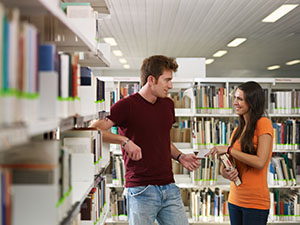 Couple Flirting in School Library